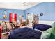 Bright bedroom featuring twin beds, nautical decor, and comfortable seating at 1404 Palmetto Blvd, Edisto Beach, SC 29438