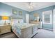 Airy bedroom with a coastal style, featuring white furniture and ocean-themed decor at 1404 Palmetto Blvd, Edisto Beach, SC 29438
