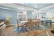 Bright dining room with a large table, pendant lights, and stylish decor at 1404 Palmetto Blvd, Edisto Beach, SC 29438