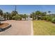 Paver driveway and manicured lawn at 1404 Palmetto Blvd, Edisto Beach, SC 29438