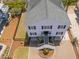 Well-maintained home with a paved driveway and meticulously landscaped front yard at 1404 Palmetto Blvd, Edisto Beach, SC 29438