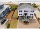Well-maintained two-story house with a beautifully landscaped yard and paved driveway at 1404 Palmetto Blvd, Edisto Beach, SC 29438