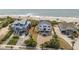 Beautifully landscaped home with a brick driveway, fenced yard, and beach access at 1404 Palmetto Blvd, Edisto Beach, SC 29438