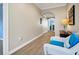 Bright hallway with wood floors, leading to various rooms of the house at 1404 Palmetto Blvd, Edisto Beach, SC 29438