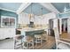 Kitchen features a tile backsplash, pendant lights, an island with seating, and stainless appliances at 1404 Palmetto Blvd, Edisto Beach, SC 29438