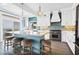 Spacious kitchen boasts an island with seating, stainless appliances, and pendant lighting at 1404 Palmetto Blvd, Edisto Beach, SC 29438