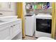 Functional laundry room with modern appliances and ample storage at 1404 Palmetto Blvd, Edisto Beach, SC 29438