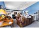 Cozy living room with blue walls, built-in shelving, and comfortable seating at 1404 Palmetto Blvd, Edisto Beach, SC 29438