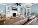Spacious living room with comfortable seating, a fireplace, and built-in shelving at 1404 Palmetto Blvd, Edisto Beach, SC 29438