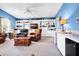 Bright living room featuring cozy furniture, built in cabinets and wet bar at 1404 Palmetto Blvd, Edisto Beach, SC 29438