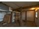 Unfinished storage room featuring wooden beams, shelves for storage, and small window at 1404 Palmetto Blvd, Edisto Beach, SC 29438