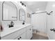 Modern bathroom featuring a double vanity with black fixtures and a shower with a white curtain at 142 Lucca Dr, Summerville, SC 29486