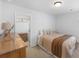 Comfortable bedroom featuring a queen bed and a dresser with an open door to a closet at 142 Lucca Dr, Summerville, SC 29486