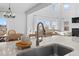Open concept kitchen flows into the living area, offering ample natural light and stylish finishes at 142 Lucca Dr, Summerville, SC 29486
