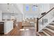 Bright living room with tall windows, hardwood floors, a fireplace, and an open layout at 142 Lucca Dr, Summerville, SC 29486