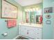 Bright bathroom with a spacious vanity, a large mirror, and tasteful decor at 1571 Blaze Ln, Charleston, SC 29412