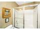 Bright bathroom featuring a bathtub, shower, toilet, and a vintage-style wall paper at 1571 Blaze Ln, Charleston, SC 29412