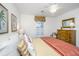Comfortable bedroom with a bed, window shutters, and a ceiling fan at 1571 Blaze Ln, Charleston, SC 29412