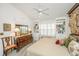 Cozy bedroom featuring twin beds, built-in shelving, and warm lighting at 1571 Blaze Ln, Charleston, SC 29412