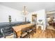Dining room with a wood table, chandelier, and view to the kitchen and living areas at 1571 Blaze Ln, Charleston, SC 29412