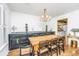 Bright dining room with wood floors, chandelier, and view to the kitchen at 1571 Blaze Ln, Charleston, SC 29412