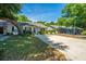Charming home with mature trees, well-maintained lawn, and inviting curb appeal at 1571 Blaze Ln, Charleston, SC 29412