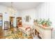 Cozy living room with fireplace, light-colored furniture, and a view to the kitchen at 1571 Blaze Ln, Charleston, SC 29412