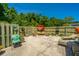 Private outdoor patio featuring comfortable seating, lush greenery, and a sunny umbrella at 1571 Blaze Ln, Charleston, SC 29412