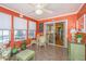 Charming sunroom featuring abundant light, tiled floors, and a small dining area at 1571 Blaze Ln, Charleston, SC 29412