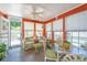 Bright sunroom with lots of light, tiled floor, and comfortable seating at 1571 Blaze Ln, Charleston, SC 29412
