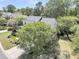 Aerial view of the home highlighting the spacious backyard, lush trees, and patio at 1733 James Basford Pl, Mount Pleasant, SC 29466