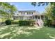 Backyard with a lush lawn, a deck, and a screened porch at 1733 James Basford Pl, Mount Pleasant, SC 29466