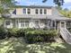 Backyard with a lush lawn, a deck, and a screened porch at 1733 James Basford Pl, Mount Pleasant, SC 29466