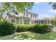 Backyard with a lush lawn, a deck, and a screened porch at 1733 James Basford Pl, Mount Pleasant, SC 29466