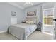 Comfortable bedroom featuring a soft carpet, bright window, and soothing blue walls at 1733 James Basford Pl, Mount Pleasant, SC 29466
