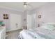 This cozy bedroom is decorated with soft colors and has a ceiling fan, closet space and carpeted flooring at 1733 James Basford Pl, Mount Pleasant, SC 29466