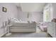 This charming bedroom has a daybed, a bedside table, and a cute vanity for a delightful retreat at 1733 James Basford Pl, Mount Pleasant, SC 29466