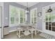 Charming breakfast nook with bright windows and stylish furnishings at 1733 James Basford Pl, Mount Pleasant, SC 29466