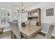 Dining room features a stylish light fixture and a hutch with glass doors at 1733 James Basford Pl, Mount Pleasant, SC 29466