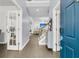 Bright foyer with hardwood floors and an open staircase leading to the upper level at 1733 James Basford Pl, Mount Pleasant, SC 29466