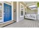 Charming front porch featuring a porch swing and blue door; perfect for welcoming guests at 1733 James Basford Pl, Mount Pleasant, SC 29466