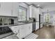 Bright kitchen features white cabinets, stainless steel appliances, and granite countertops at 1733 James Basford Pl, Mount Pleasant, SC 29466
