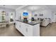 Open concept kitchen with island flowing into the living room, perfect for entertaining at 1733 James Basford Pl, Mount Pleasant, SC 29466