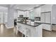 Modern kitchen with white cabinetry, a black granite island, and stainless steel appliances at 1733 James Basford Pl, Mount Pleasant, SC 29466