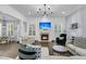 Bright living room featuring a fireplace, elegant chandelier, and modern decor with ample seating at 1733 James Basford Pl, Mount Pleasant, SC 29466