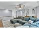 Comfortable living area features a sectional sofa, plush cushions, and built-in shelves for storage and display at 1733 James Basford Pl, Mount Pleasant, SC 29466