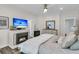 Cozy main bedroom featuring a fireplace, television, and stylish decor for a relaxing ambiance at 1733 James Basford Pl, Mount Pleasant, SC 29466