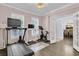 Dedicated workout room with modern exercise equipment, ample natural light, and hardwood floors at 1733 James Basford Pl, Mount Pleasant, SC 29466