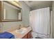 Bathroom featuring vanity with sink, framed mirror, and shower, designed for practicality and comfort at 1781 Brittlebush Ln, Johns Island, SC 29455