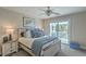 Bedroom boasts a king bed, ceiling fan, and access to a private balcony for relaxed indoor-outdoor living at 1781 Brittlebush Ln, Johns Island, SC 29455